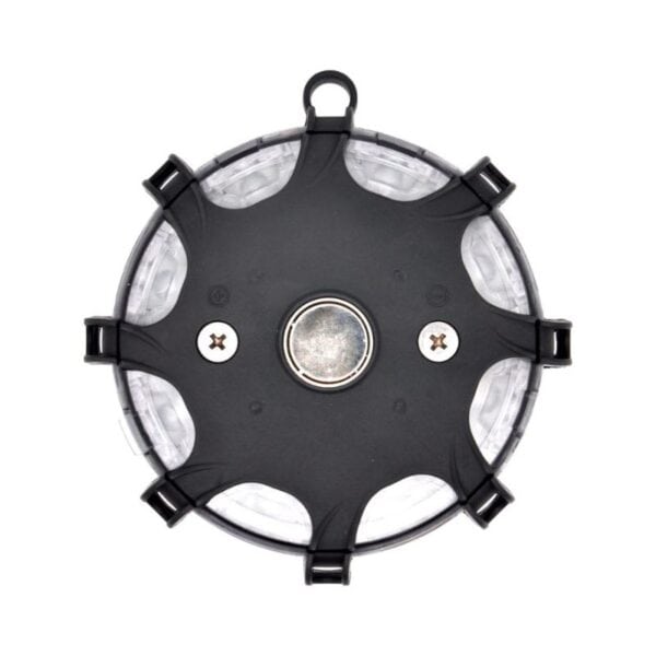 Top view of a black-and-white circular device with a central button, two screws, and an attachment ring on top.