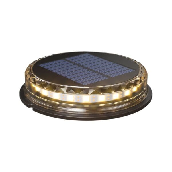 A circular solar-powered LED light with a black top panel and an illuminated ring of LEDs on its edge.