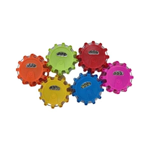 Six multi-colored, gear-shaped objects with transparent tops reveal electronic components inside. Colors: orange, green, red, yellow, blue, pink.