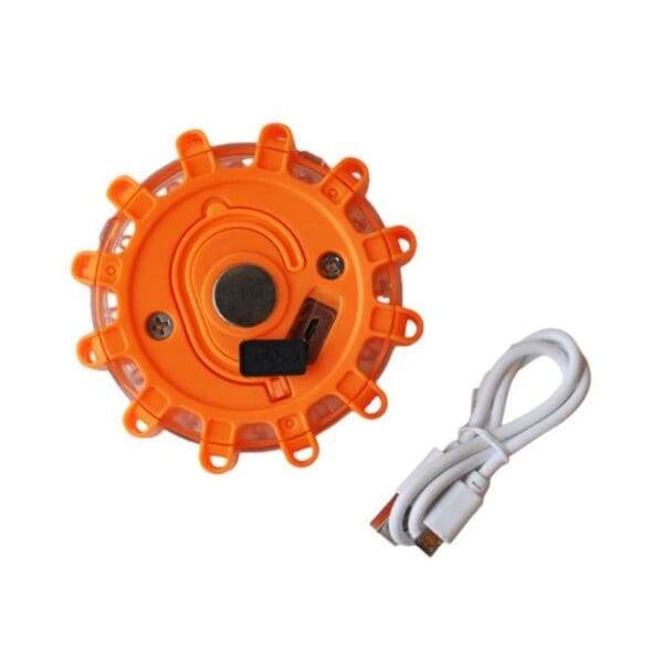 A circular orange LED light with edge bulbs and a white charging cable.