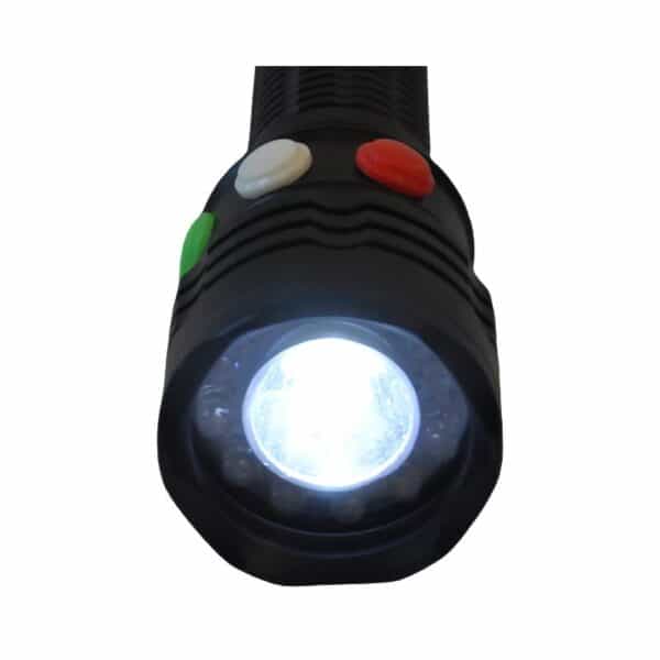 A black flashlight with a bright light and three buttons in white, red, and green colors on the handle.