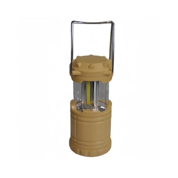 A portable tan LED lantern with a metal handle.