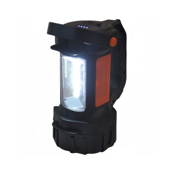 A portable black and orange lantern with a bright light, cylindrical base, and top handle.