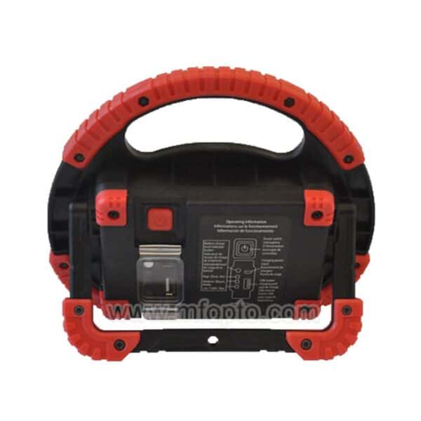 A red and black portable work light with a sturdy handle, control buttons, and usage instructions on the back.