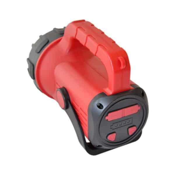 A red and black handheld flashlight with a large handle and side buttons, viewed from the back.