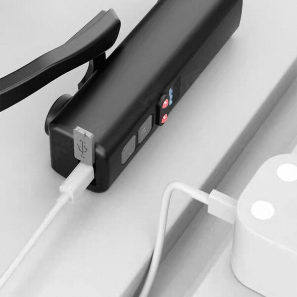 Black charging station with USB ports for electronic devices.