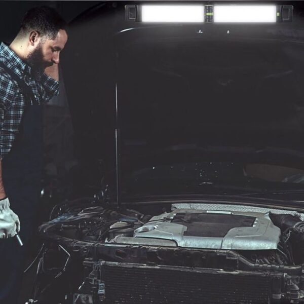 Wrench and mechanic inspecting car engine under hood in auto repair shop, automotive repair, engine diagnostics, car maintenance, vehicle servicing, auto mechanic tools, car repair process, vehicle troubleshooting, professional auto service, diagnostic technician.