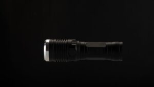 High-powered tactical flashlight with durable black metal finish, perfect for outdoor, emergency, and professional use. Compact, powerful LED lighting for versatile illumination.