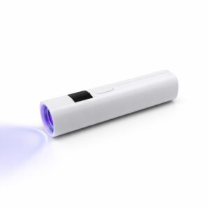 WK1042 handheld nail lamp emitting purple LED light on a white surface.