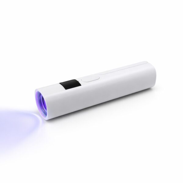 WK1042 handheld nail lamp emitting purple LED light on a white surface.